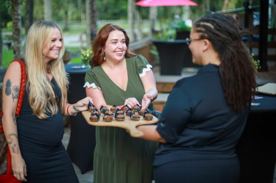 Customers grabbing appetizers at V Pizza Catering Mixer at Julep Palm Valley Jacksonville Florida Photographer Terrence Tyson
