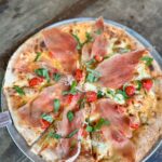 Pizza with Prosciutto di Parma on it