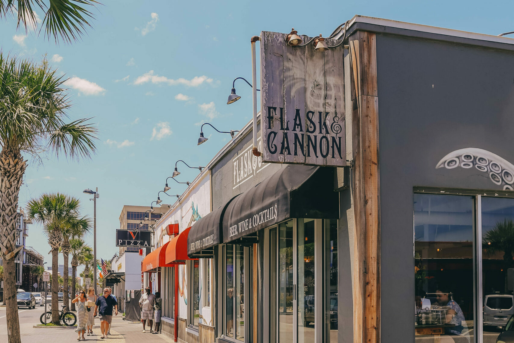 flask and cannon and v pizza signs