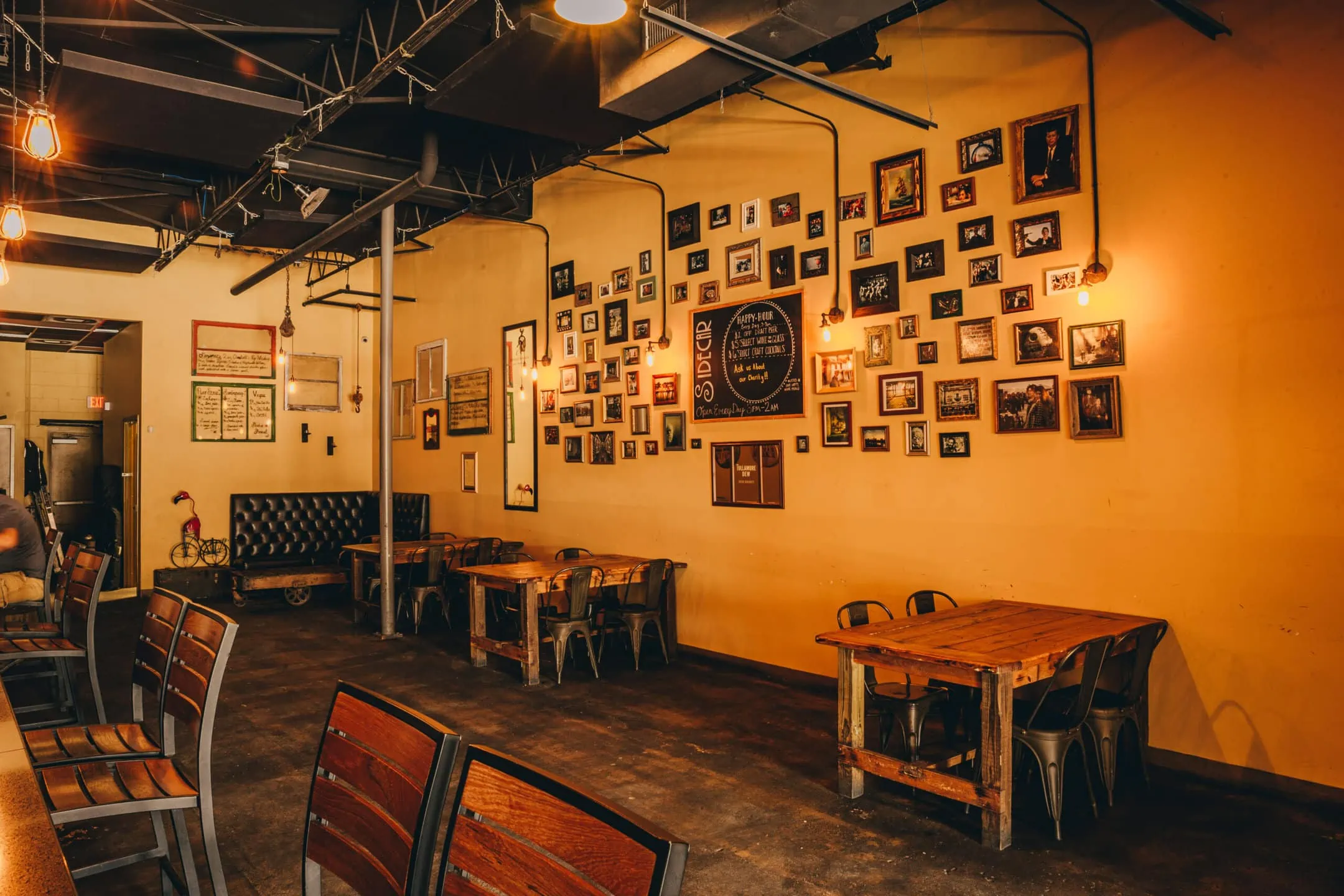 indoor seating beside wall with framed photos