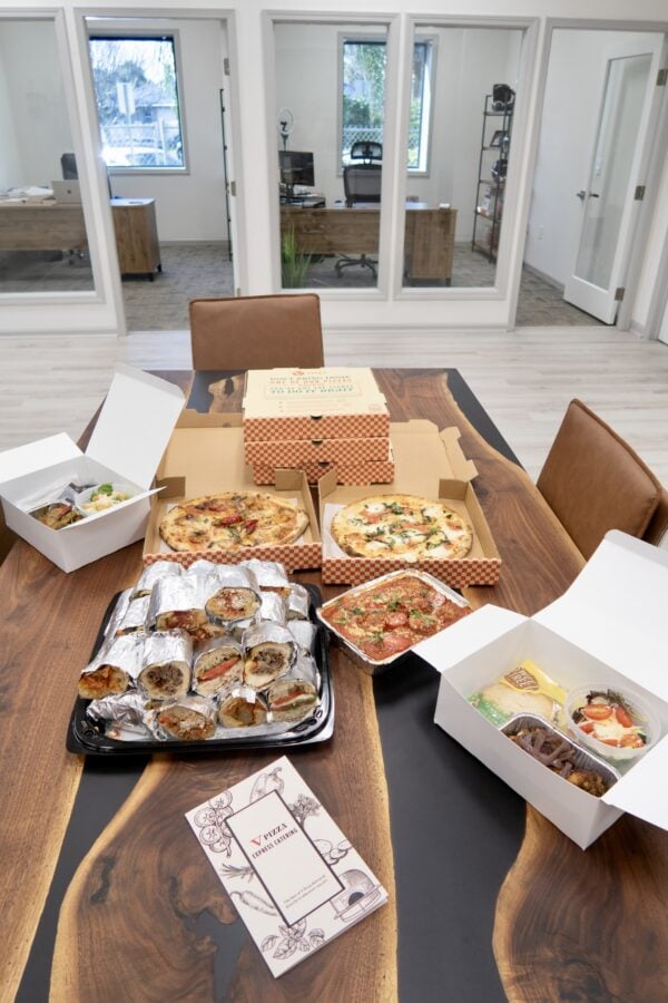 Express catering food spread (sandwiches, pizzas, wings, and meatballs)