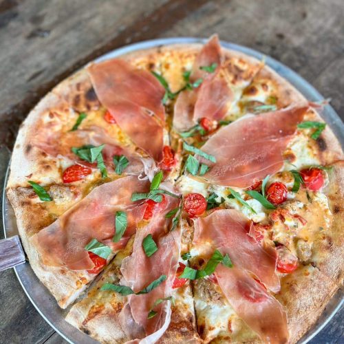 Pizza with Prosciutto di Parma on it